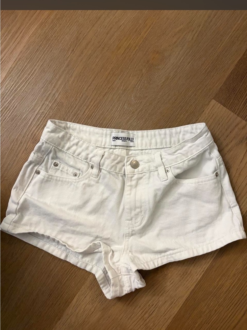 Princess Polly mid-rise white denim shorts